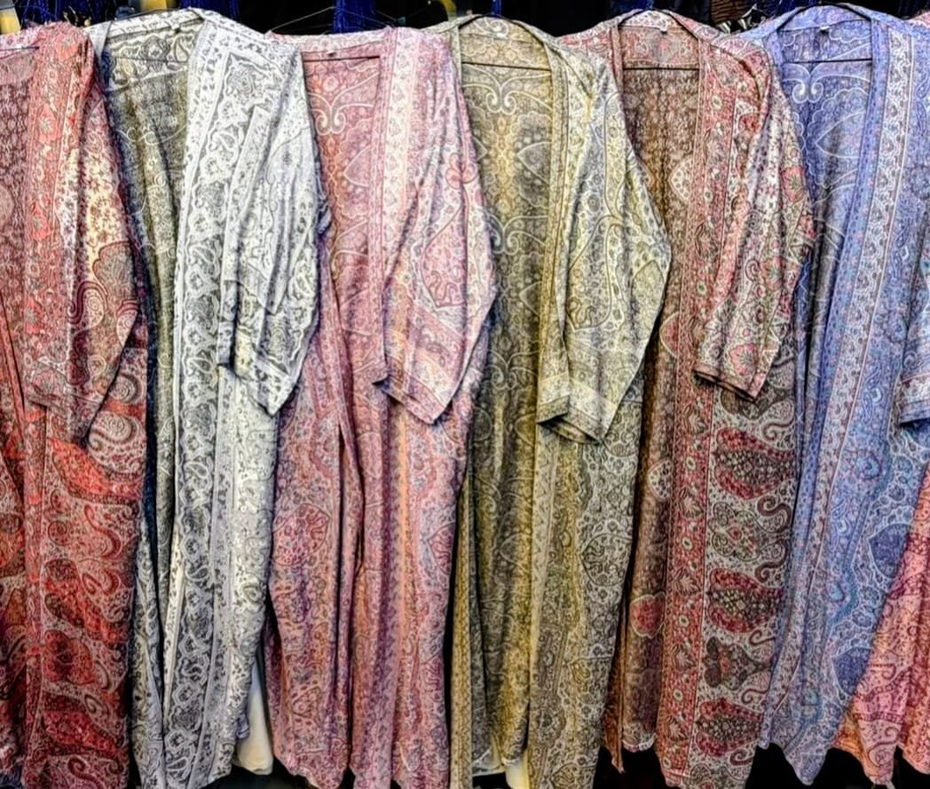 row of colorful patterned abayas